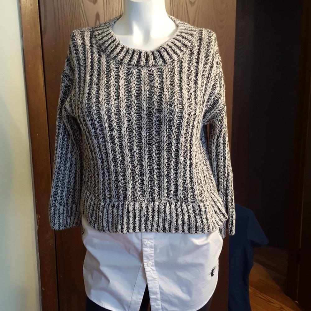 Sweater with attached faux blouse in front.